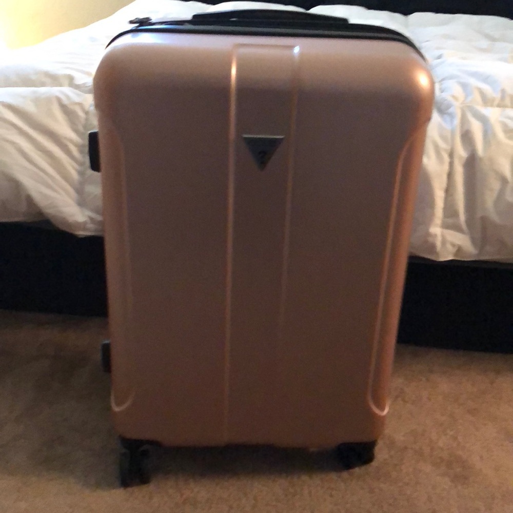 Guess rose  gold luggage brand new !